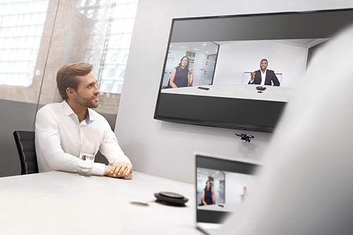 Man in conference room using Jabra PanaCast for video conference
