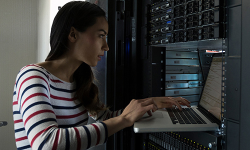 Female network engineer configuring Server