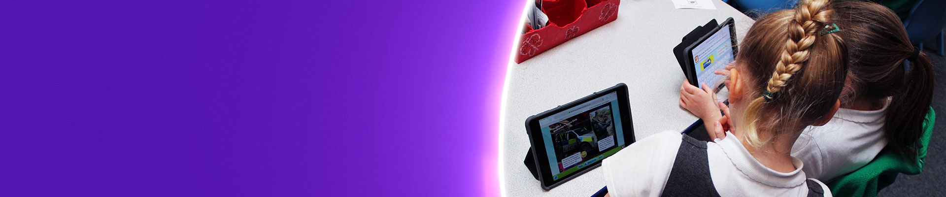 Girls using ipads in the classroom