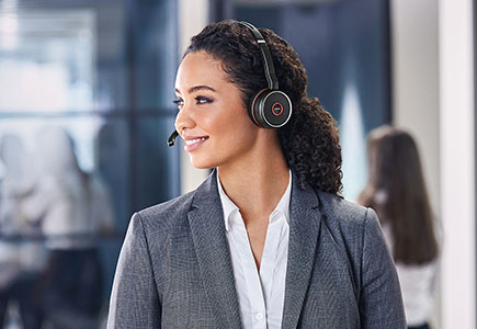 Woman walking wearing Jabra Evolve 75 headset