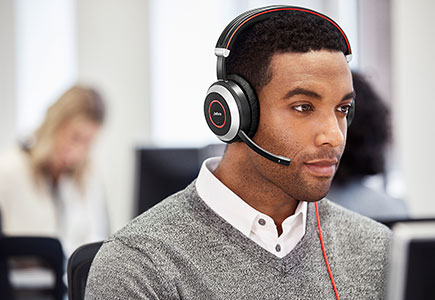 Man wearing Jabra Evolve 80 headset