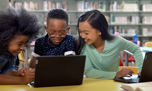 Two students using an affordable windows device