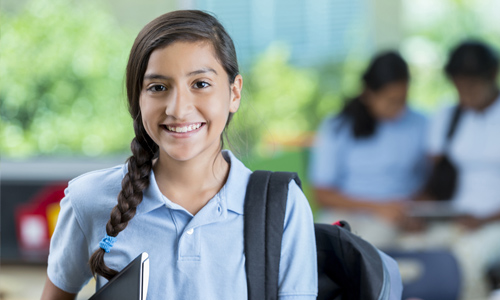 Female student carrying a Microsft device