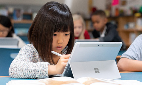 Young girl using a Surface device