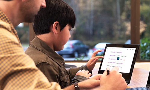 teacher observing student using windows 10 mobile device