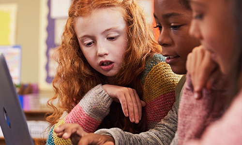 Students in classroom sharing windows 10 mobile device