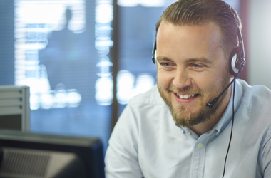 IT specialist on phone to customer