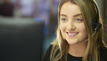 Female IT specialist on phone with customer