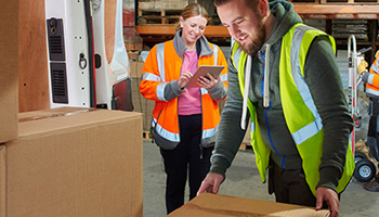 BT warehouse staff loading delivery van