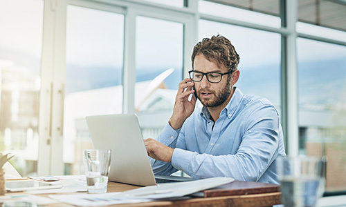 Man on phone setting up email applications