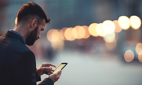 man on mobile enjoying automatically updated office software