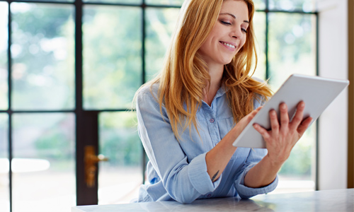 Female customer using IT equipment recently bought from BT