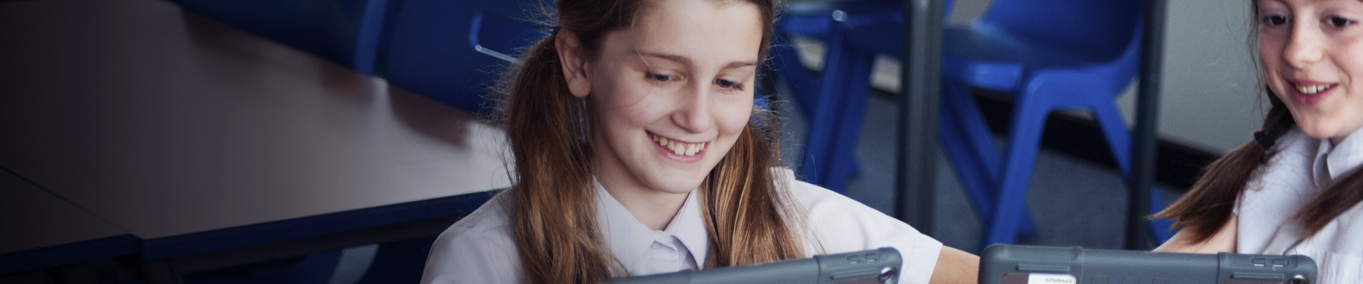 Girl smiling with iPad