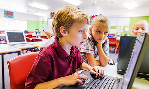 Students in classroom sharing windows 10 mobile device