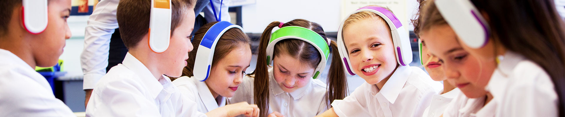 School students collaboarting using headsets