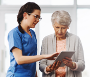 Nurse and patient using a tablet device