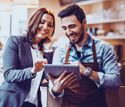 Cafe owners using tablet device