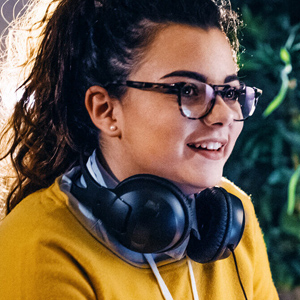 Women student with a headset round her neck