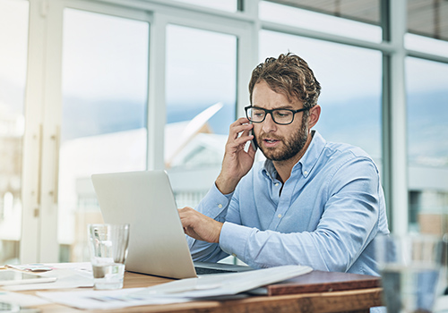 Business man on the phone arranging finance