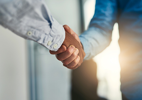 Two business men shaking hands