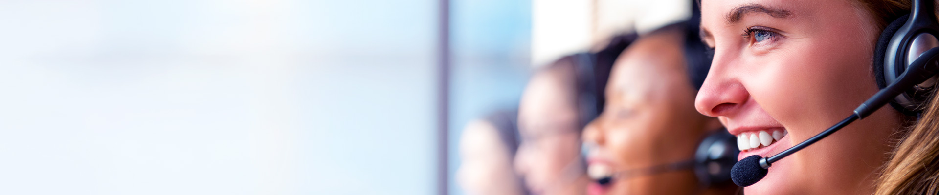 Female IT specialist using headset offering free advice to customers