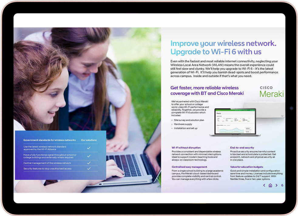 Two young students outdoors looking at a laptop screen with a wireless network powered by a faster, more reliable and improved BT Wi-Fi 6 wireless network